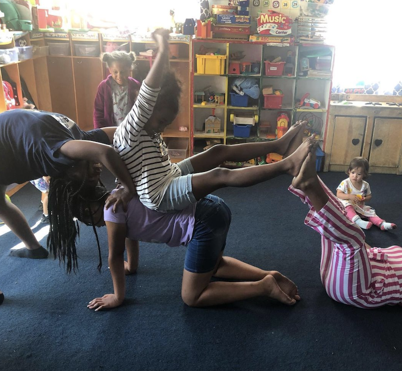 Girls are playing gymnastics in the playroom at The Learning Box.